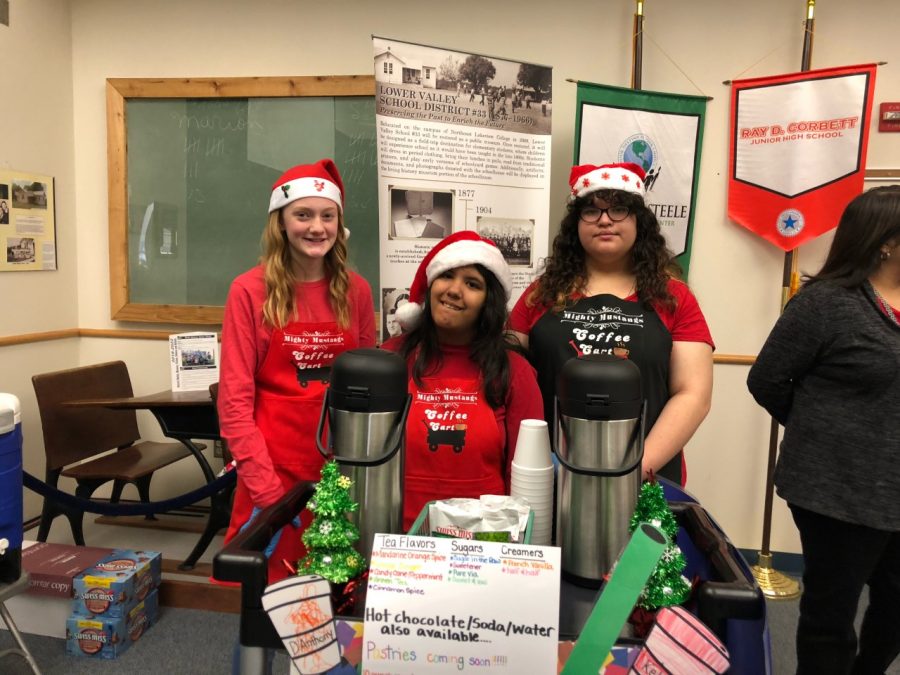 Students serve hot chocolate, baked goods and huge smiles at Central Office.