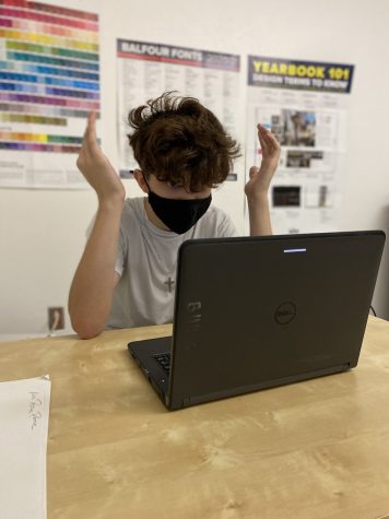 Eighth grader Dustin Gingerich shows frustration when Schoology is not allowing him to access the document. 