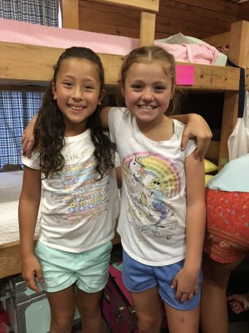 Students Laci Reifenberg and Graycee Porter grew up going to summer camp together.
